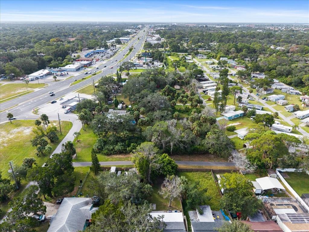 Pier Road New Port Richey, FL 34652 - Photo 7 of 17 an aerial view of residential houses with outdoor space and trees