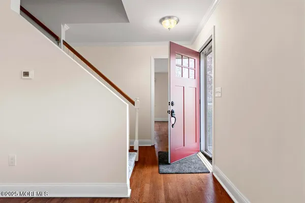 a view of front door with stairs