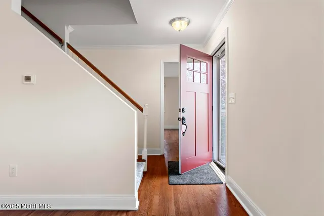 a view of front door with stairs
