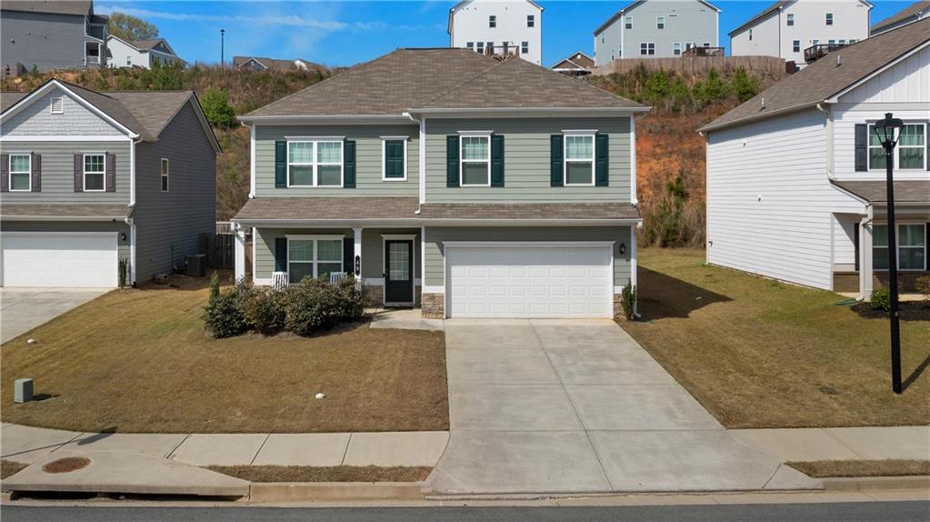 49 Thacker Trail Adairsville, GA 30103 - Photo 1 of 40 a front view of a house with yard