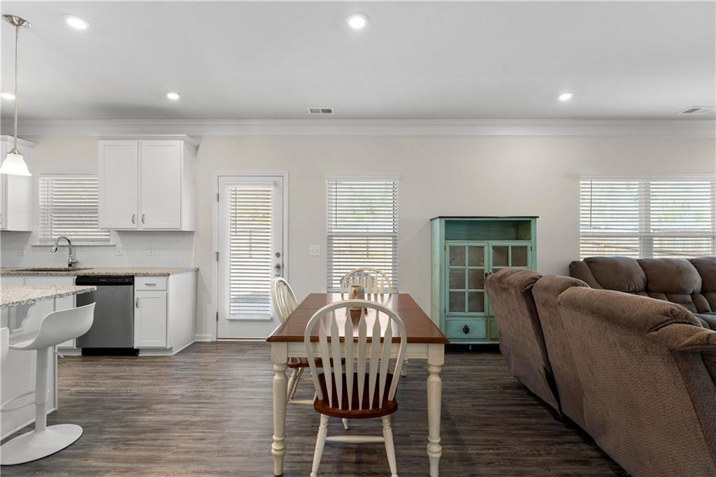 49 Thacker Trail Adairsville, GA 30103 - Photo 12 of 40 a living room with furniture a dining table and a fireplace