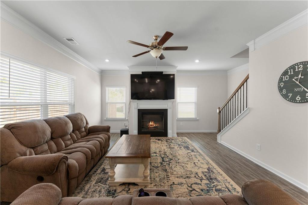 49 Thacker Trail Adairsville, GA 30103 - Photo 15 of 40 a living room with furniture a fireplace and a flat screen tv