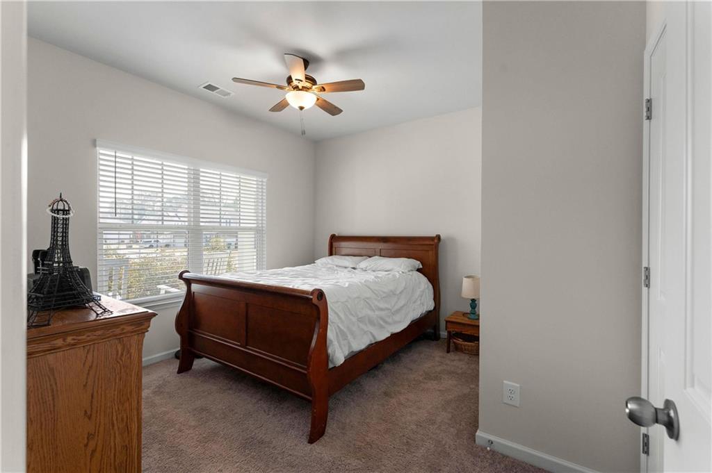 49 Thacker Trail Adairsville, GA 30103 - Photo 26 of 40 a bed room with a bed and a couch