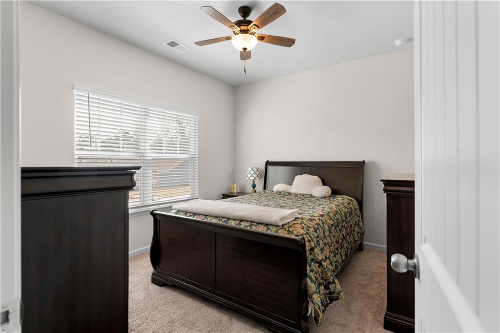 49 Thacker Trail Adairsville, GA 30103 - Photo 30 of 40 a bedroom with a bed and a window