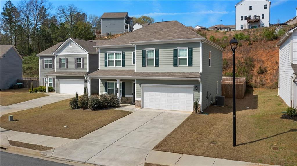 49 Thacker Trail Adairsville, GA 30103 - Photo 38 of 40 a front view of a house with a yard and garage