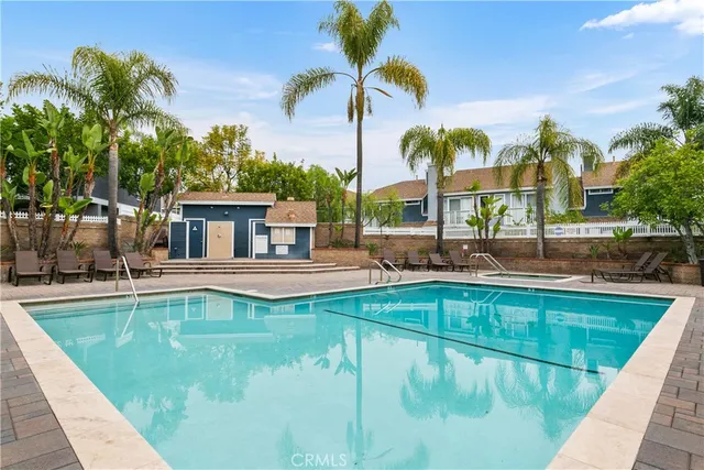 a view of swimming pool with chairs
