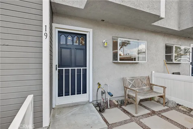 a view of a dinning room with a table and chairs