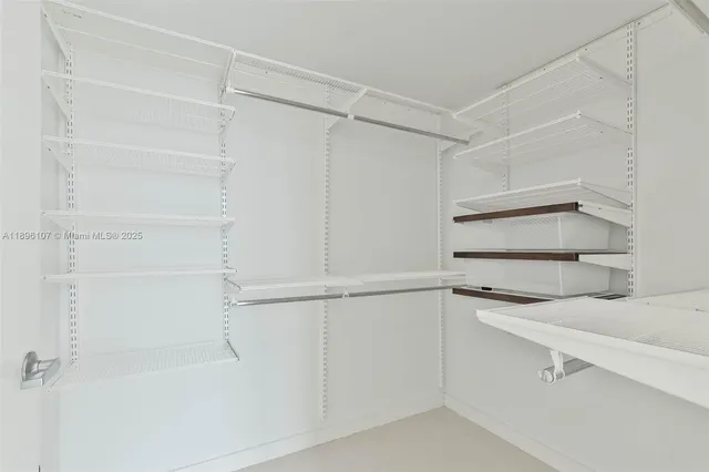 a kitchen with white cabinets and a sink