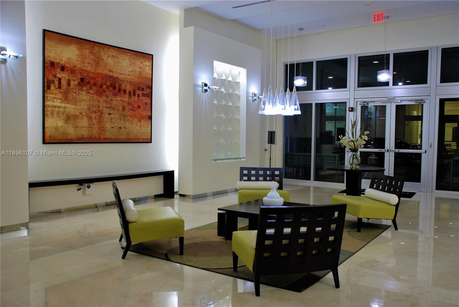 9055 Southwest 73rd Court, Unit 1402 Miami, FL 33156 - Photo 23 of 31 a living room with furniture and a floor to ceiling window