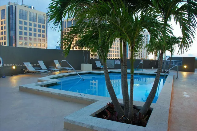 a view of a living room and floor to ceiling window