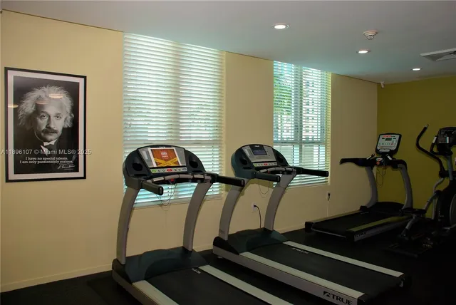 a room with gym equipment and a large window