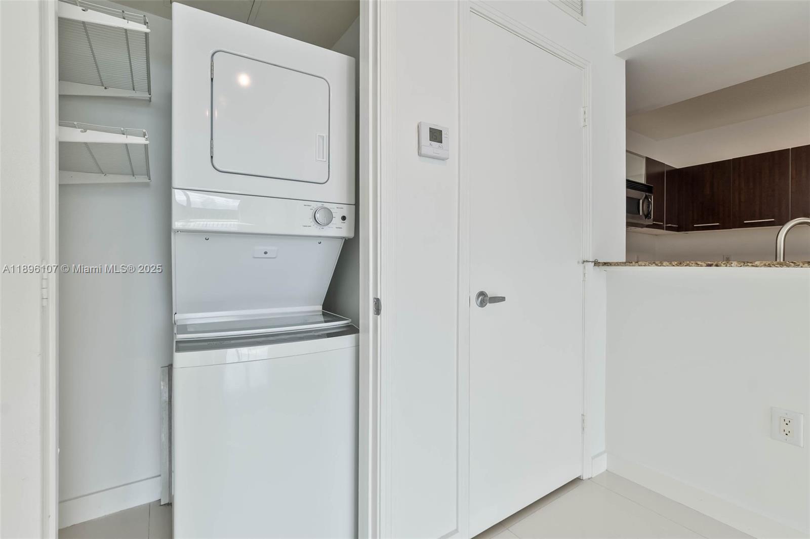 9055 Southwest 73rd Court, Unit 1402 Miami, FL 33156 - Photo 10 of 31 a view of washer and dryer