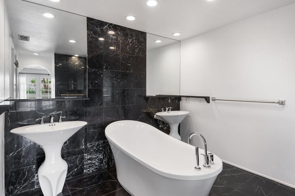 68515 Risueno Road Cathedral City, CA 92234 - Photo 13 of 29 a bathroom with a toilet sink and mirror