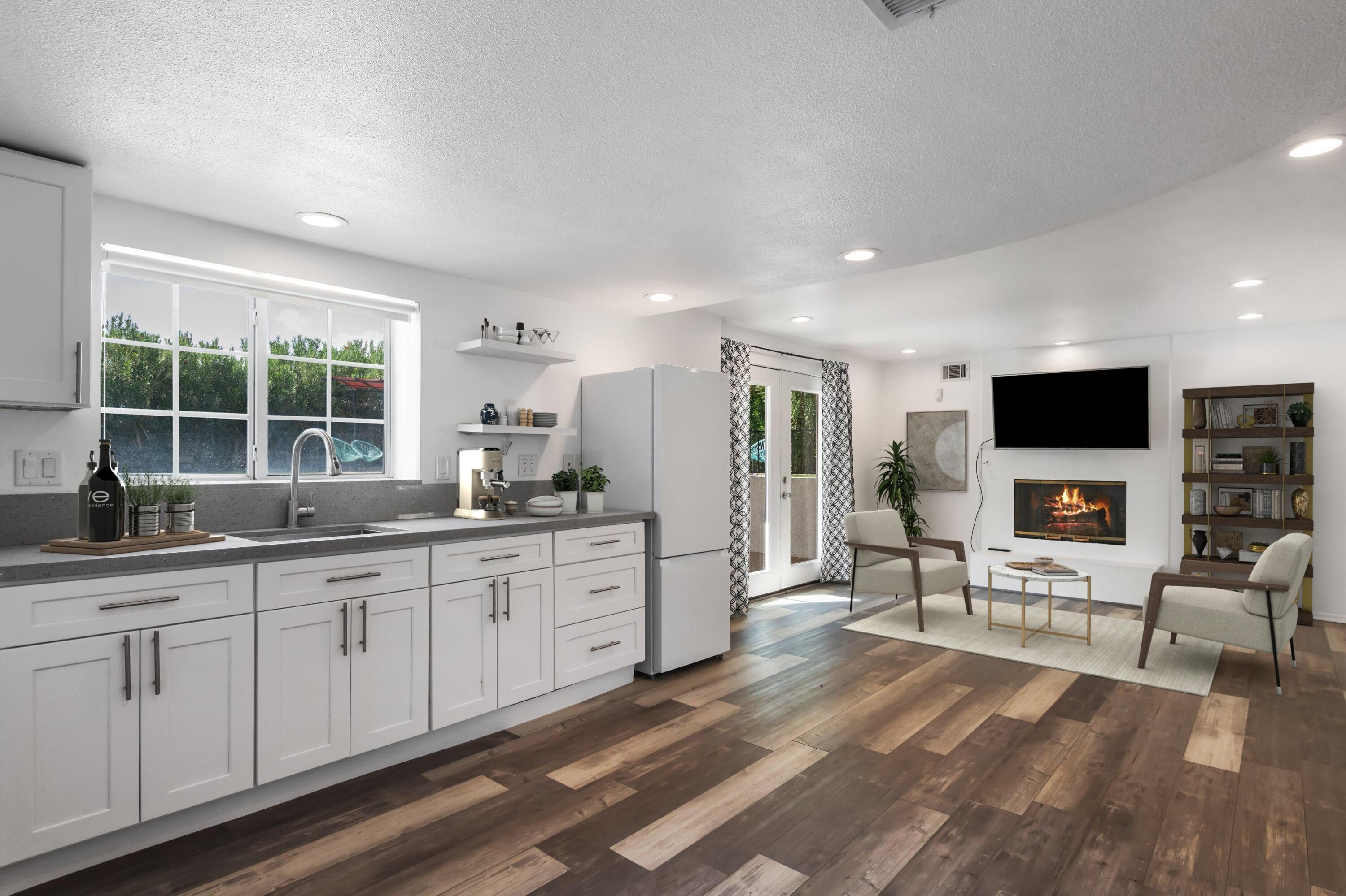 68515 Risueno Road Cathedral City, CA 92234 - Photo 16 of 29 a large white kitchen with stainless steel appliances granite countertop a sink and a stove