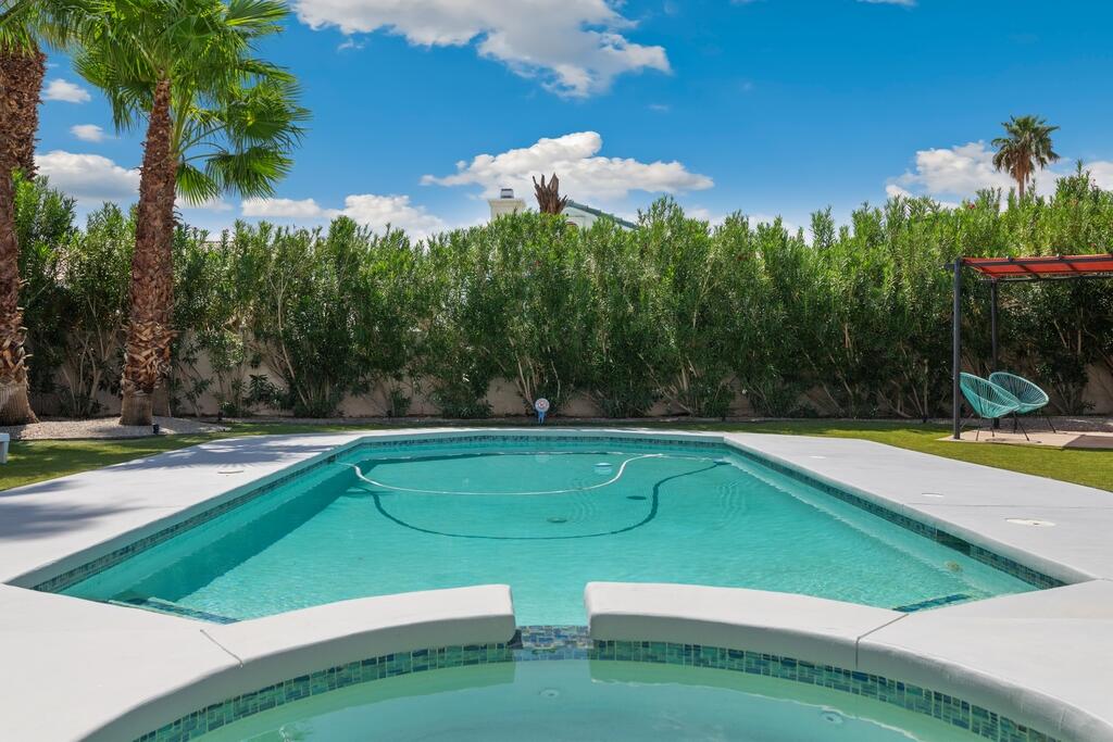 68515 Risueno Road Cathedral City, CA 92234 - Photo 23 of 29 a view of a swimming pool with a yard