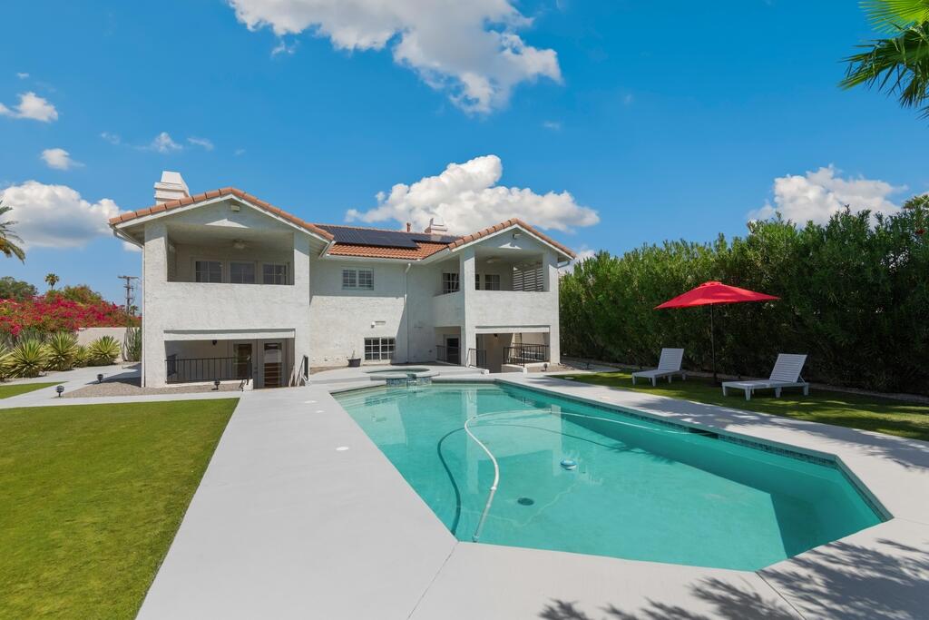 68515 Risueno Road Cathedral City, CA 92234 - Photo 24 of 29 a view of a house with a swimming pool