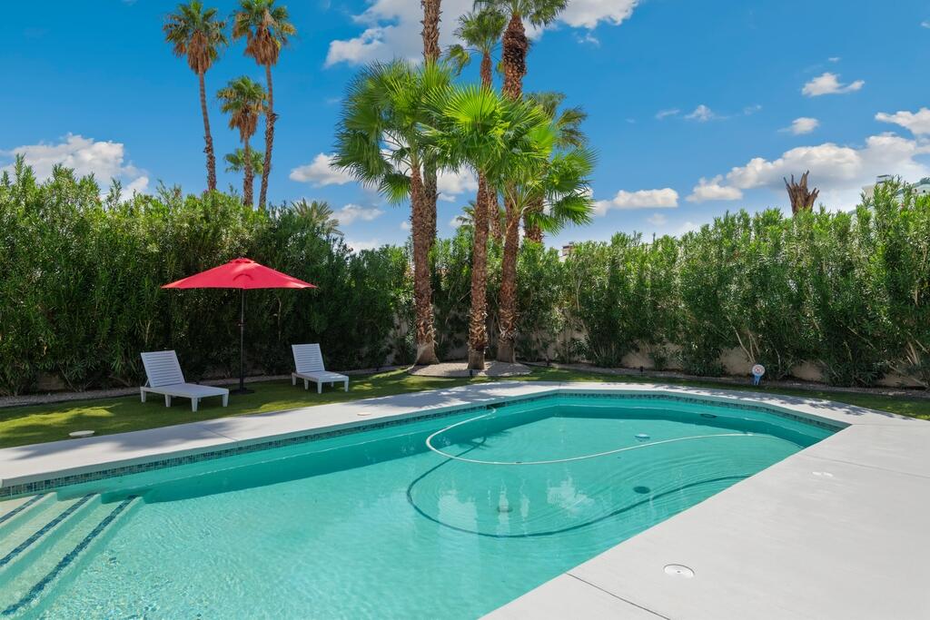 68515 Risueno Road Cathedral City, CA 92234 - Photo 26 of 29 a swimming pool with outdoor seating and yard