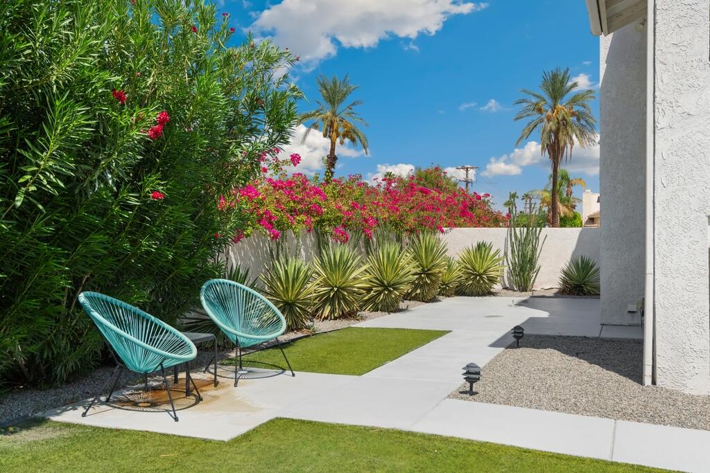 68515 Risueno Road Cathedral City, CA 92234 - Photo 28 of 29 a view of a chairs and table in a garden
