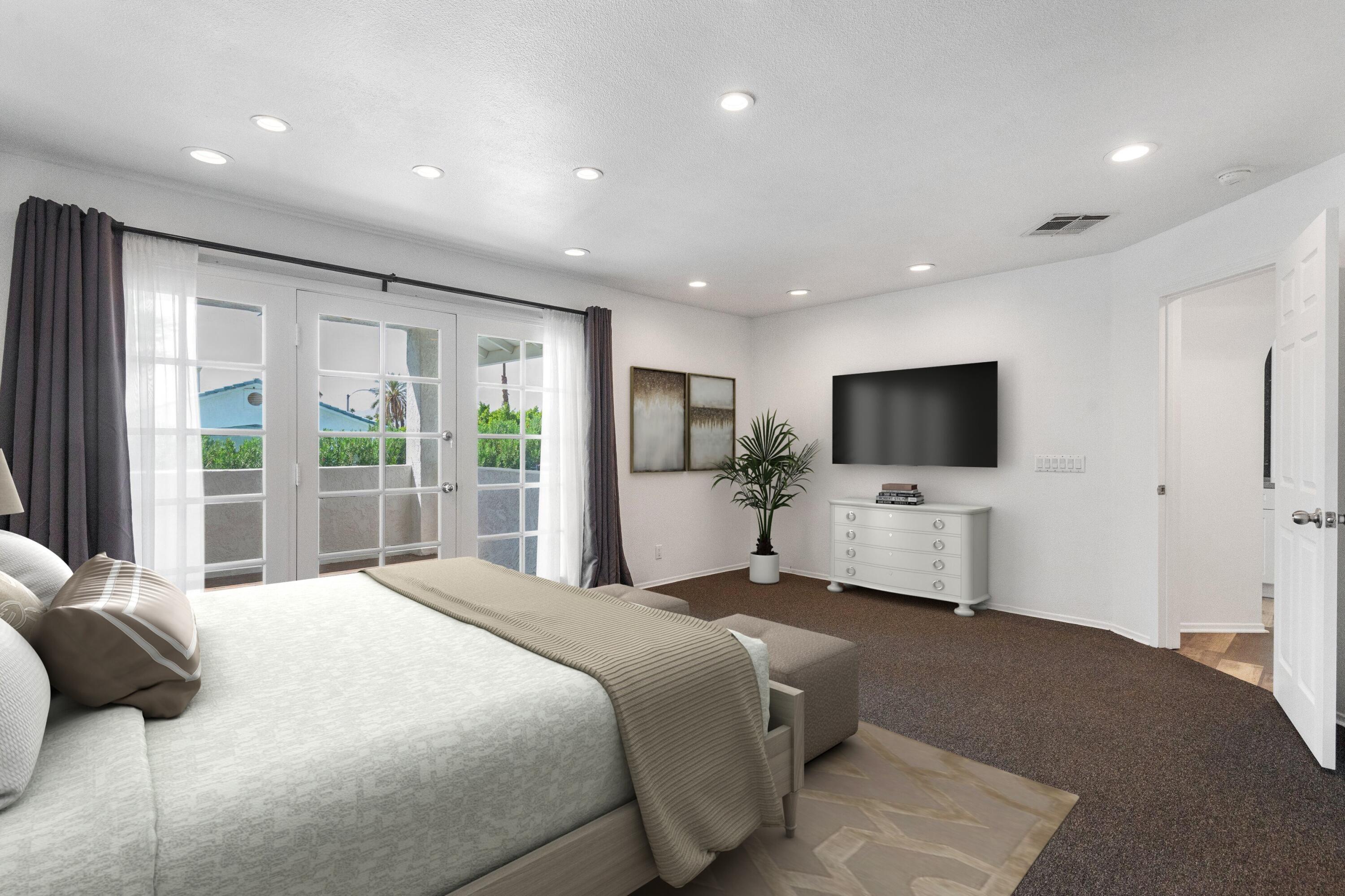 68515 Risueno Road Cathedral City, CA 92234 - Photo 10 of 29 a large bedroom with a bed and a flat screen tv