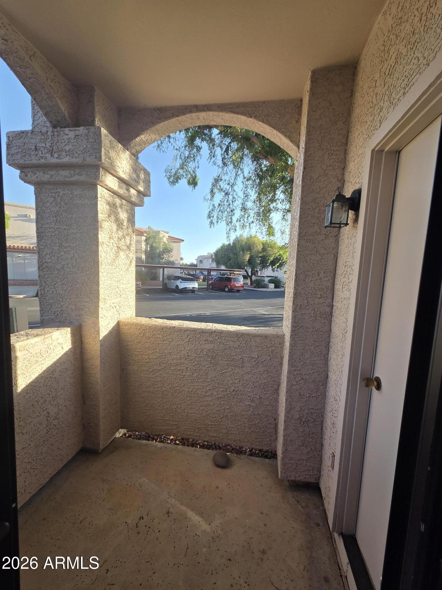 9151 West Greenway Road, Unit 182 Peoria, AZ 85381 - Photo 16 of 22 Back patio and outside storage closet