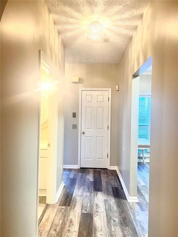 3854 Austin Park Lane Decatur, GA 30032 - Photo 10 of 44 a view of a hallway with wooden floor and bathroom