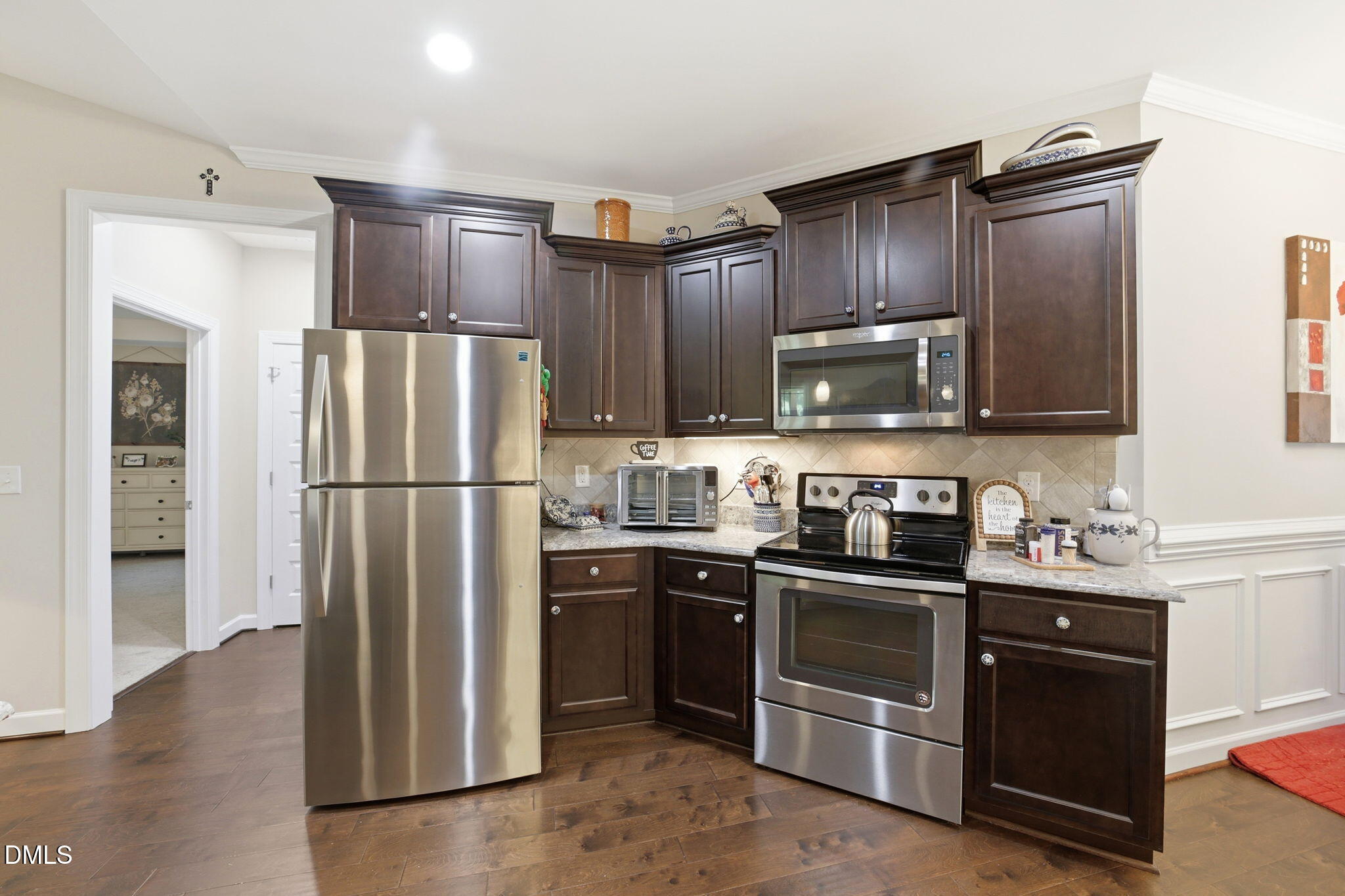 1547 Lassiter Pond Road Four Oaks, NC 27524 - Photo 15 of 45 a kitchen with stainless steel appliances granite countertop a refrigerator stove and sink
