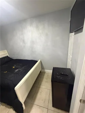 a view of an empty room and wooden floor