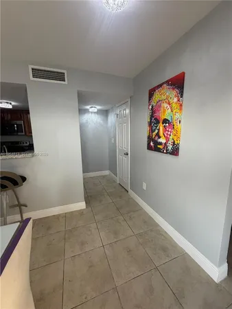 a view of a hallway with workspace