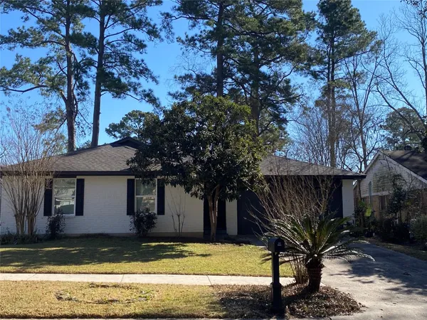 a view of a house with pool and sitting area