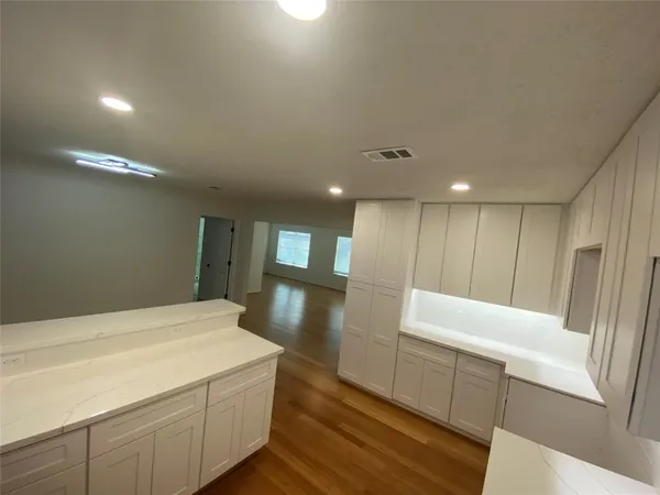 a room with a bed and furniture