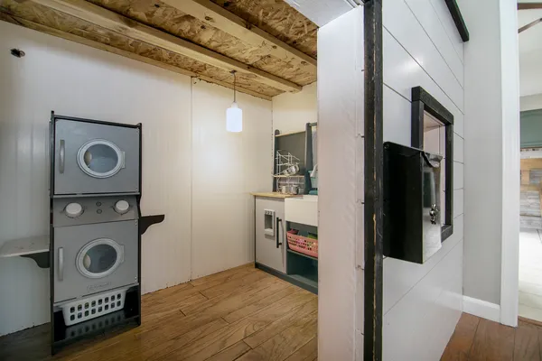 a view of storage and utility room with washer and dryer