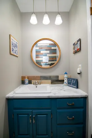 a bathroom with a sink and a mirror