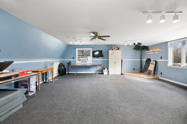 a view of a livingroom with furniture and a garage