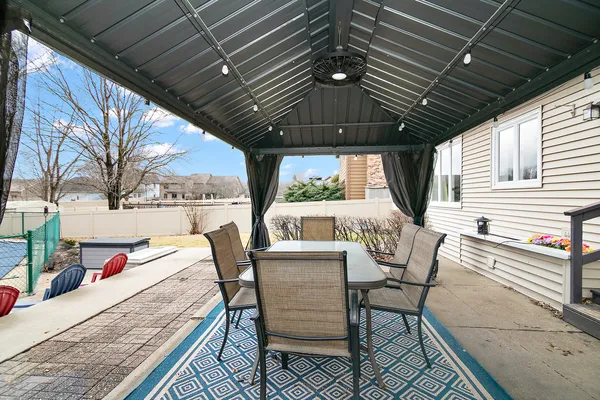 a view of an outdoor sitting area with furniture