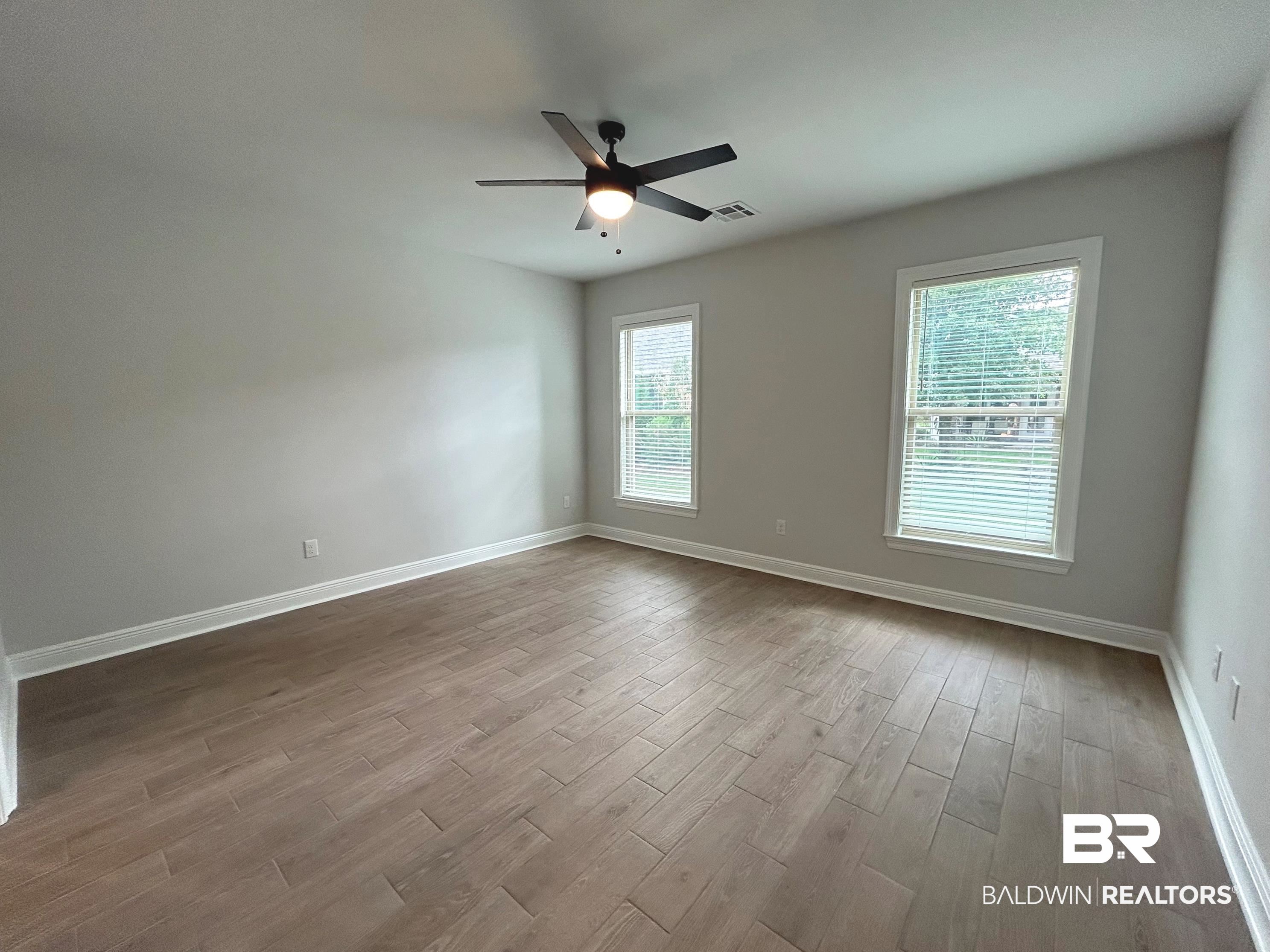 860 Sumter Loop Foley, AL 36535 - Photo 11 of 26 Spare room featuring ceiling fan and light wood-type flooring
