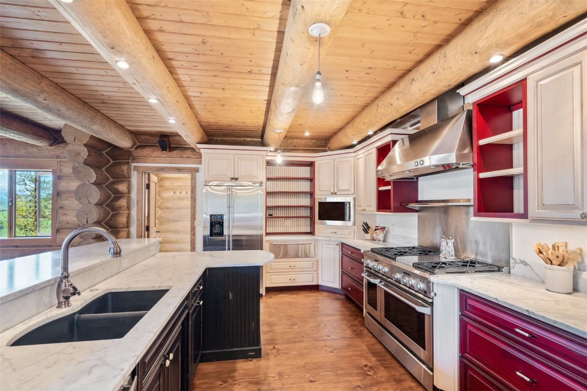 245 Easy Bend Trail Silverthorne, CO 80498 - Photo 15 of 45 a kitchen with stainless steel appliances granite countertop a sink and stove