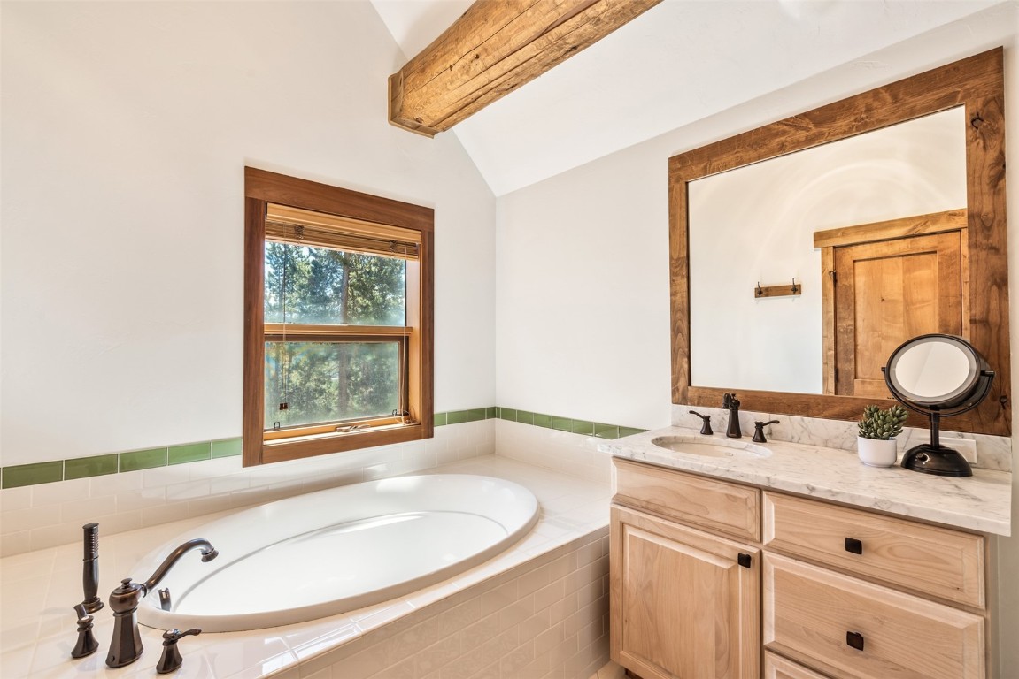 245 Easy Bend Trail Silverthorne, CO 80498 - Photo 25 of 45 a bathroom with a granite countertop sink and a mirror