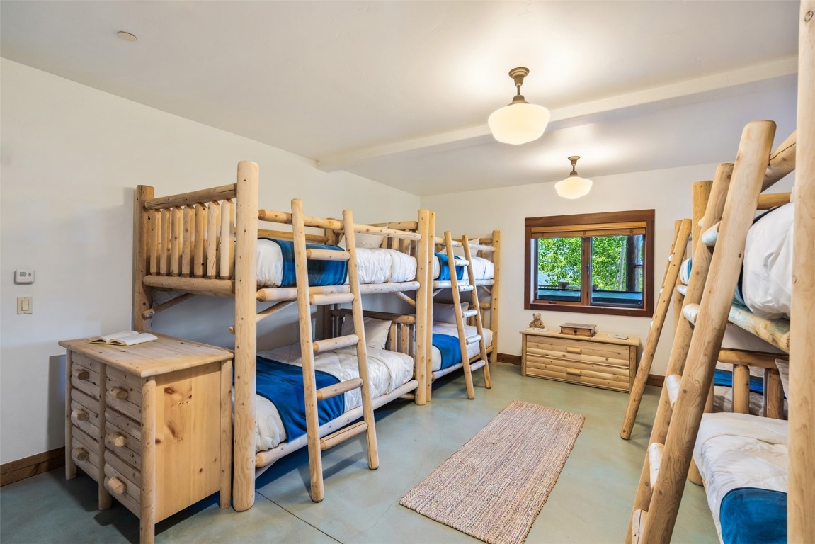 245 Easy Bend Trail Silverthorne, CO 80498 - Photo 27 of 45 a view of a bedroom with furniture and window