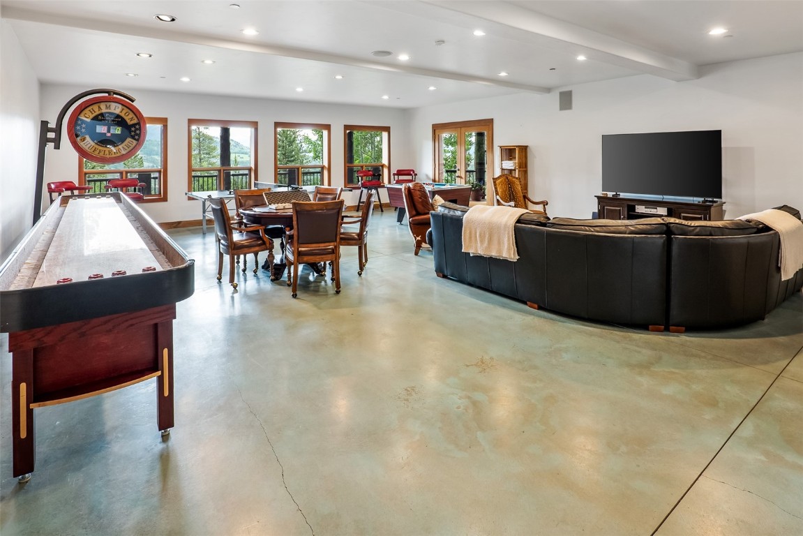 245 Easy Bend Trail Silverthorne, CO 80498 - Photo 29 of 45 a living room with furniture a flat screen tv and a large window