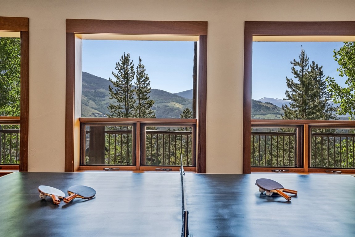 245 Easy Bend Trail Silverthorne, CO 80498 - Photo 31 of 45 a view of empty room with floor to ceiling window and wooden floor