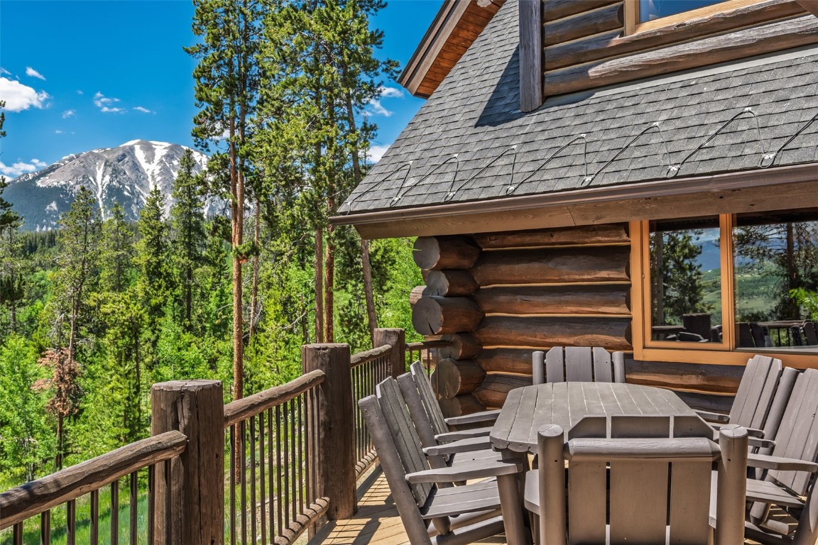 245 Easy Bend Trail Silverthorne, CO 80498 - Photo 33 of 45 a view of a patio with table and chairs with wooden floor and fence