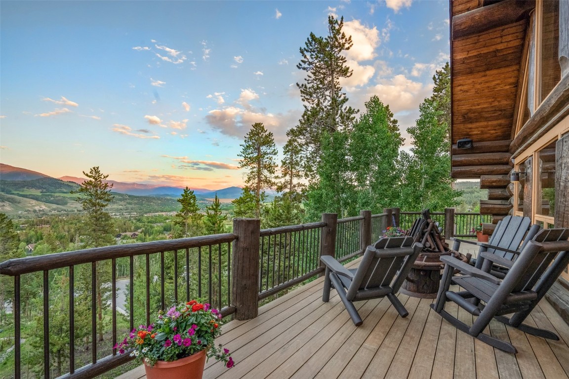 245 Easy Bend Trail Silverthorne, CO 80498 - Photo 36 of 45 a view of a balcony with wooden chairs and floor to ceiling window