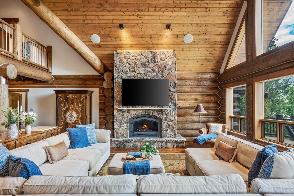 245 Easy Bend Trail Silverthorne, CO 80498 - Photo 8 of 45 a living room with furniture a fireplace and a flat screen tv