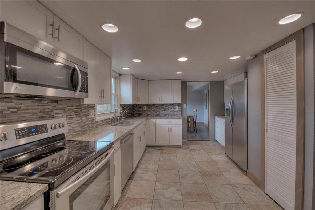 747 Deer Path Road Dillon, CO 80435 - Photo 1 of 29 a kitchen with a sink stainless steel appliances and cabinets