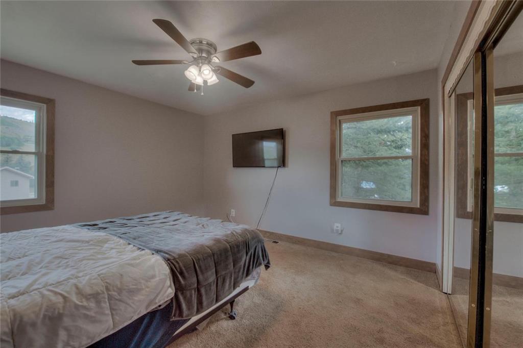 747 Deer Path Road Dillon, CO 80435 - Photo 16 of 29 a bedroom with a bed and a window