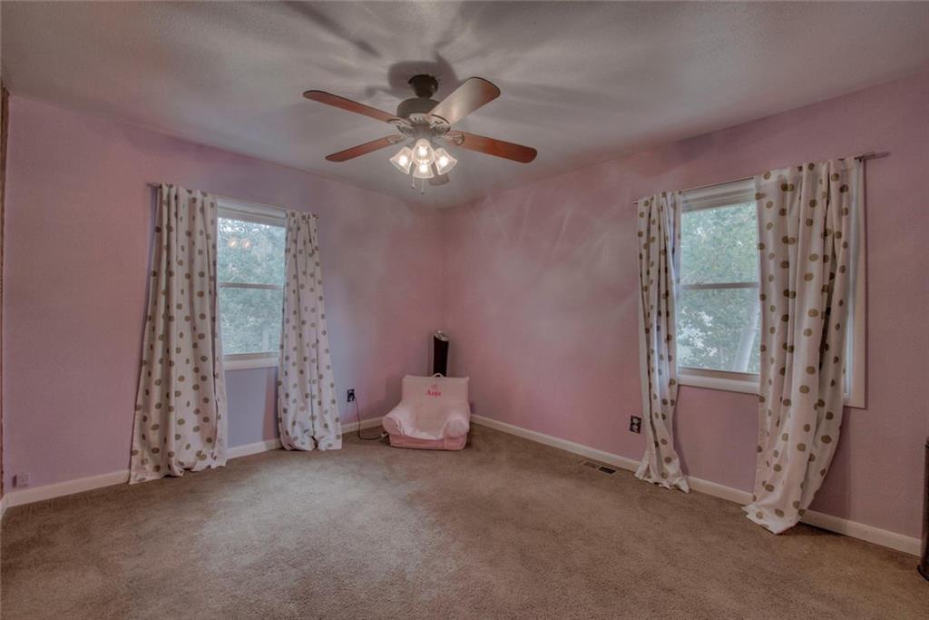 747 Deer Path Road Dillon, CO 80435 - Photo 19 of 29 a big room with windows and chandelier fan