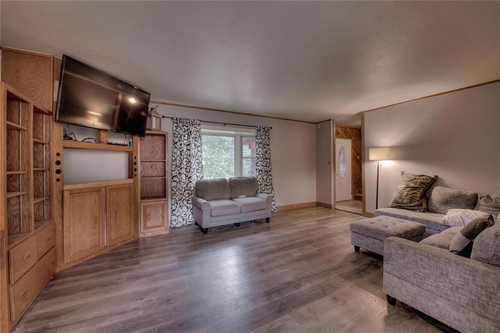 747 Deer Path Road Dillon, CO 80435 - Photo 3 of 29 a living room with furniture and a flat screen tv