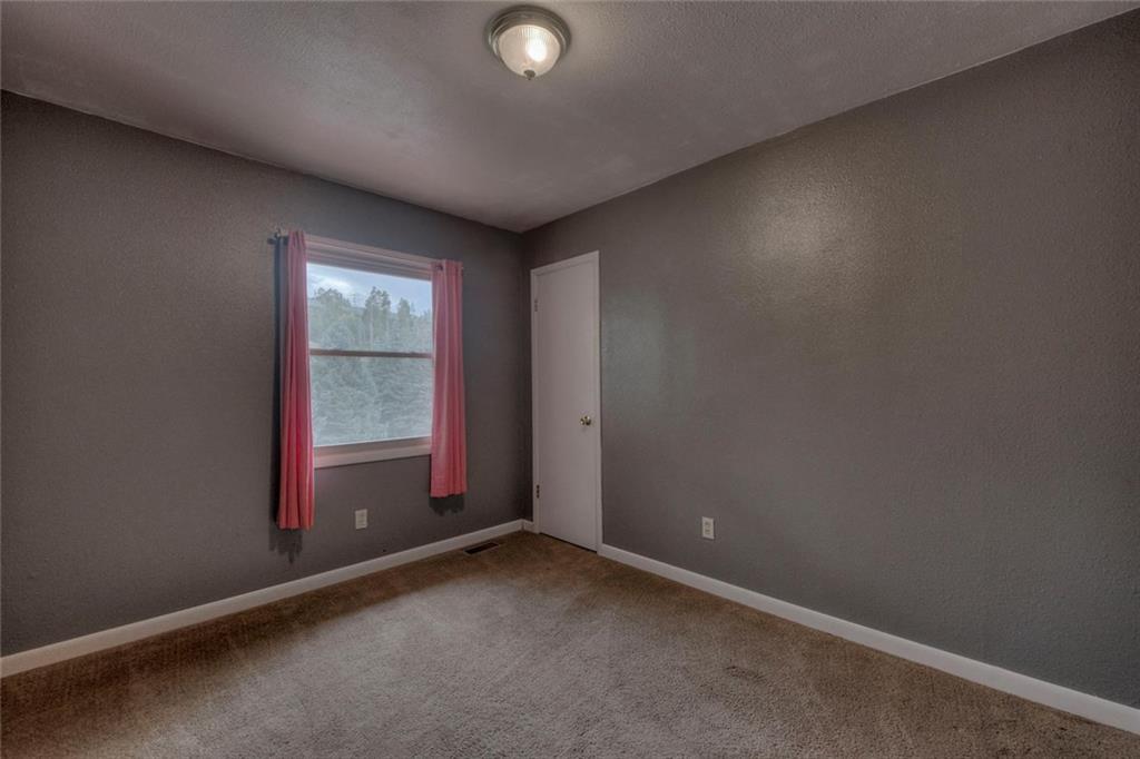 747 Deer Path Road Dillon, CO 80435 - Photo 22 of 29 an empty room with windows