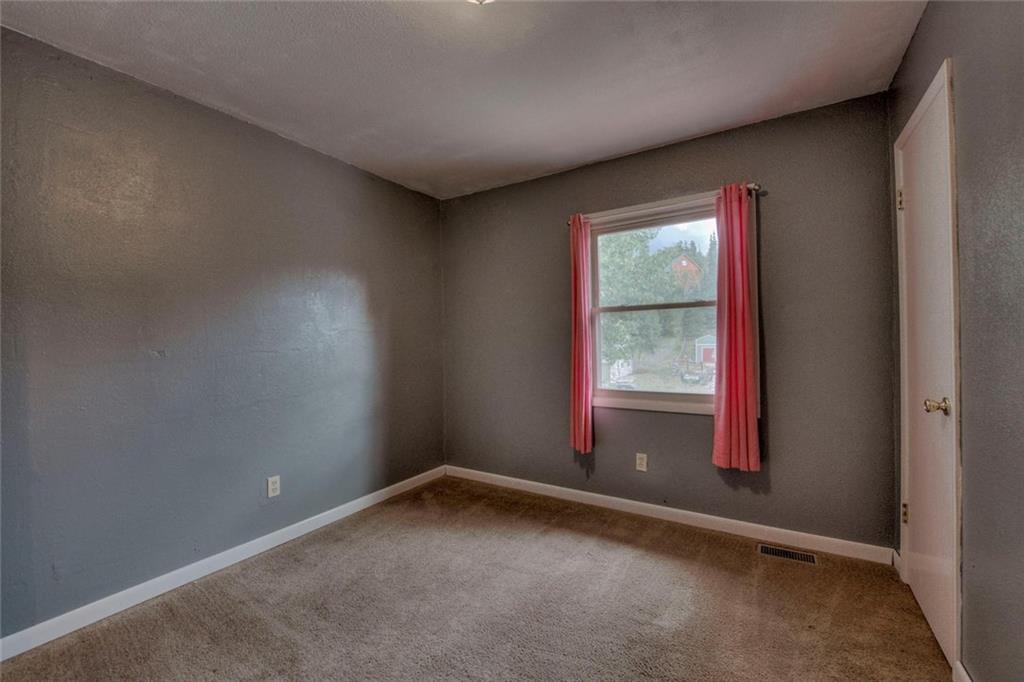 747 Deer Path Road Dillon, CO 80435 - Photo 24 of 29 an empty room with windows