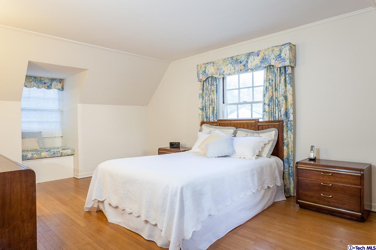 44 San Miguel Road Pasadena, CA 91105 - Photo 12 of 18 a bedroom with a bed and a window